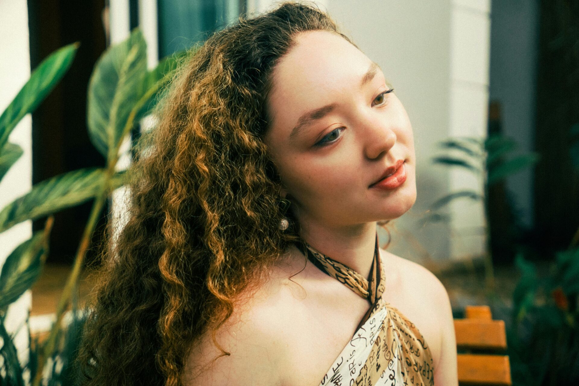 Natural woman reflecting calm energy, representing inner harmony through chakra balancing techniques.