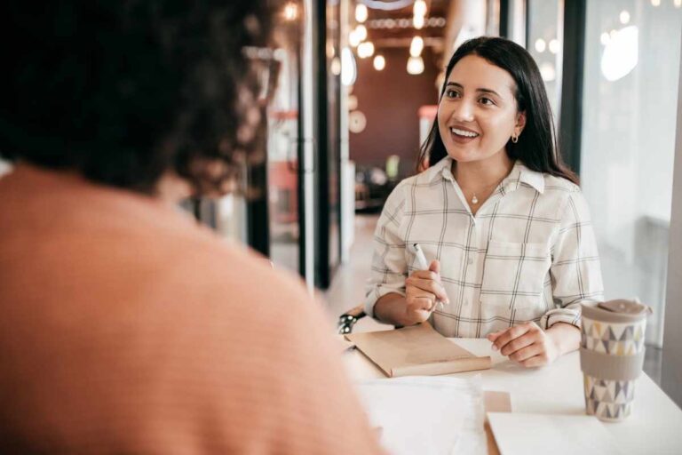 confident woman having a conversation, showing the truth about building confidence