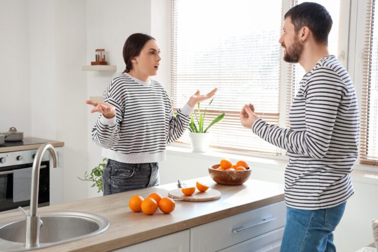 how to deal with past mistakes in a relationship couple talking calmly in kitchen