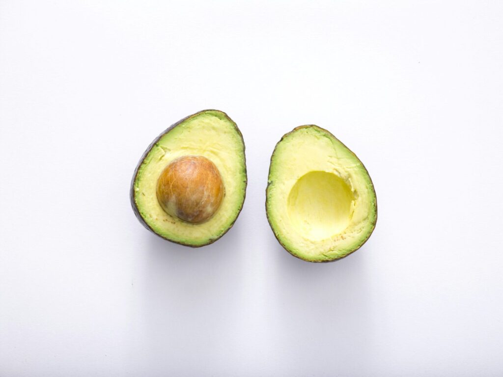 Fresh avocado sliced open — a powerful superfood rich in healthy fats, ideal among foods to balance women's hormones.
