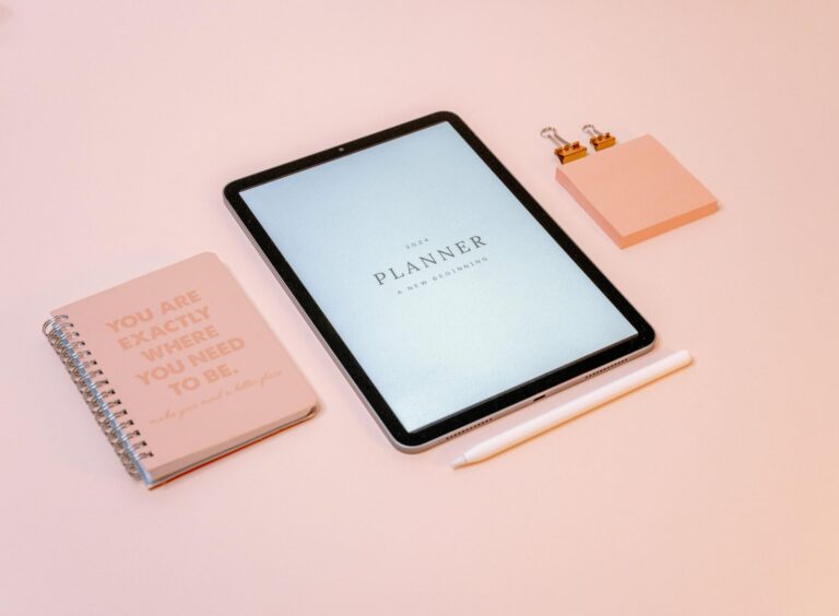 Open planner on a desk, representing ambitious goal setting and a common reason why New Year's resolutions fail.