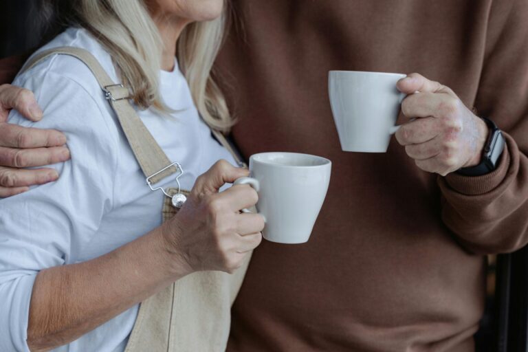 "Married couple holding their cups, representing the quiet moments in marriage and the challenges couples face in marriage, such as communication and emotional connection.