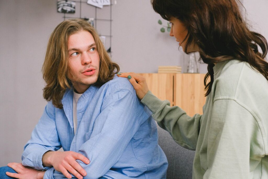 Woman attentively listening to her partner express himself, a key step in learning how to overcome resentment in marriage.