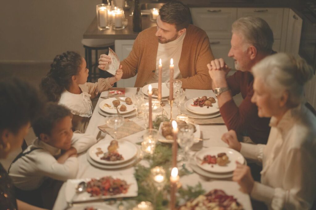 family having Christmas dinner together, navigating holiday drama with relatives