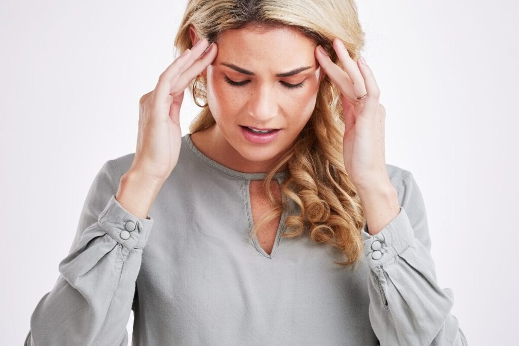 Woman experiencing brain fog and confusion, possible sign of hormonal imbalance in women