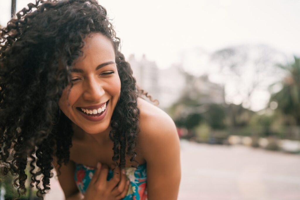 Smiling woman radiating confidence and positivity