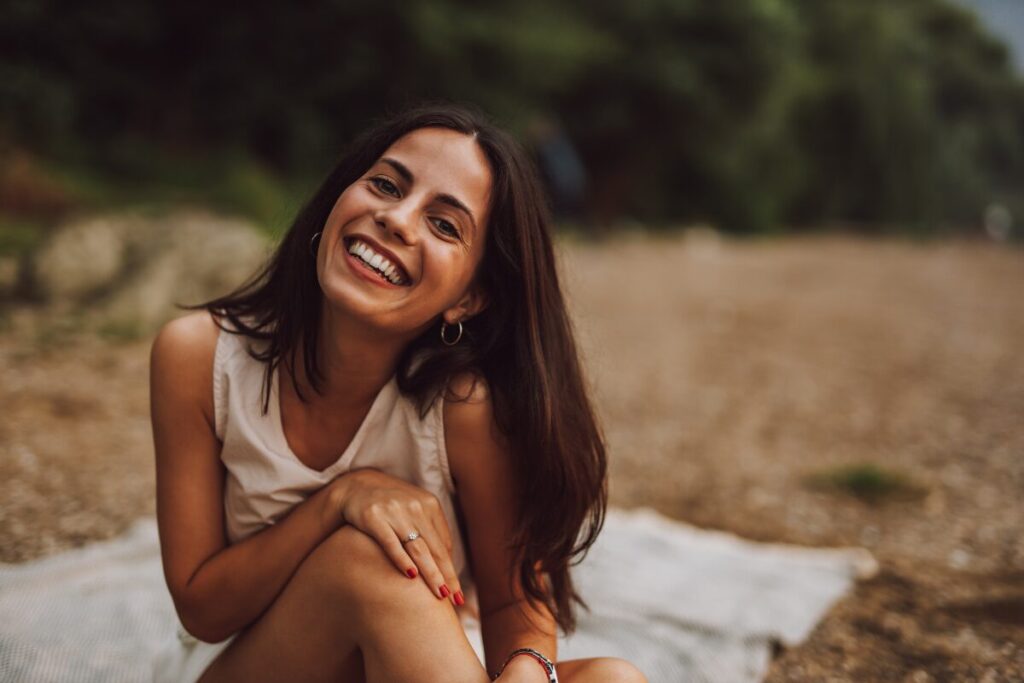 a happy woman who respects herself - things you stop doing when you respect yourself