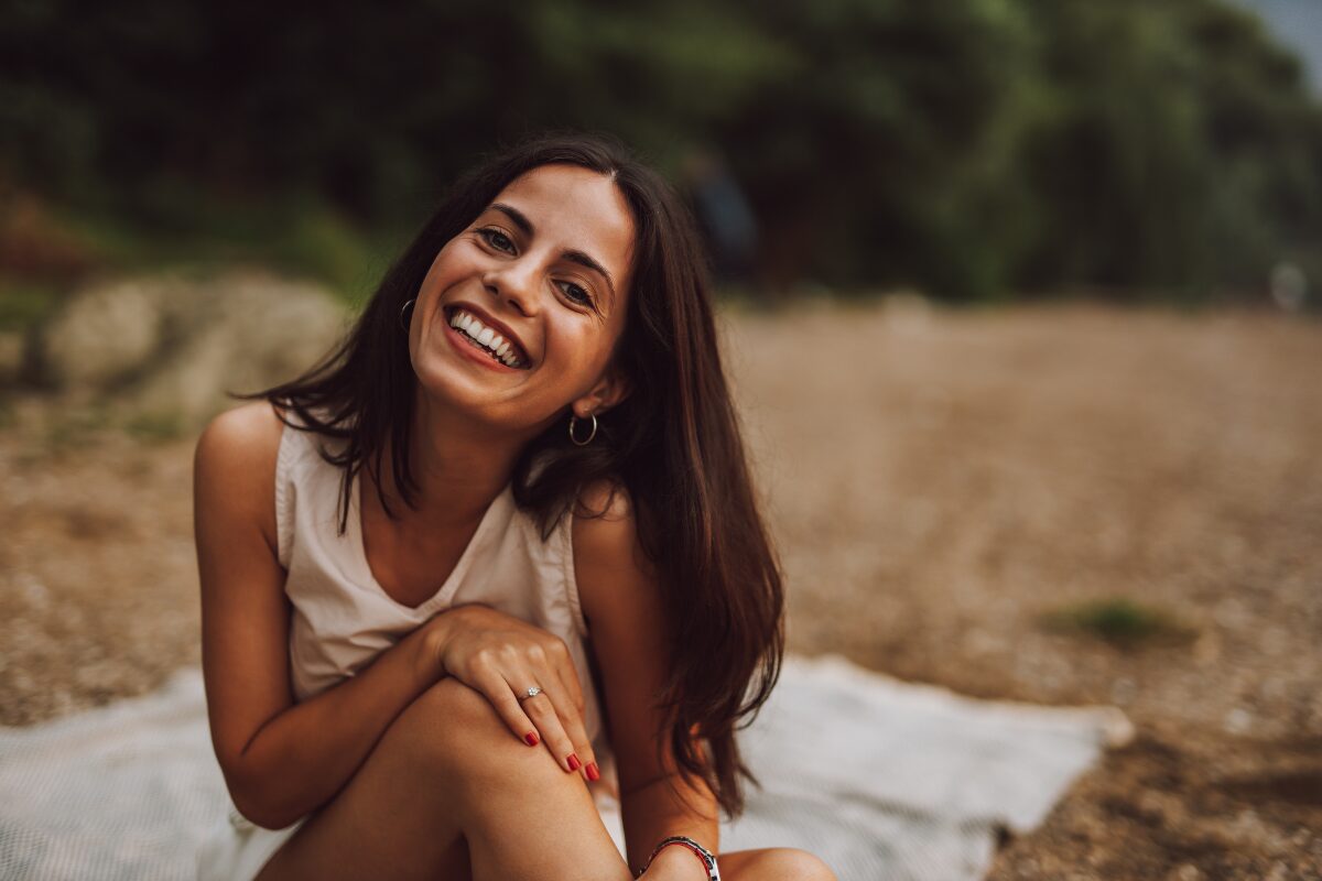 a happy woman who respects herself - things you stop doing when you respect yourself