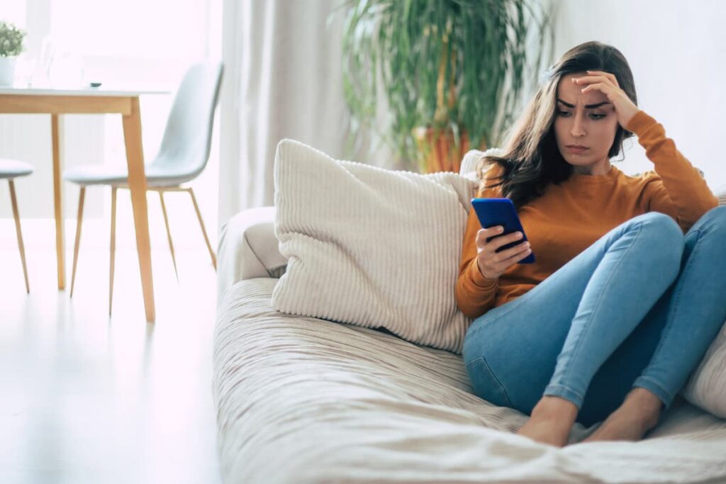 why you need a digital detox - woman on phone.
